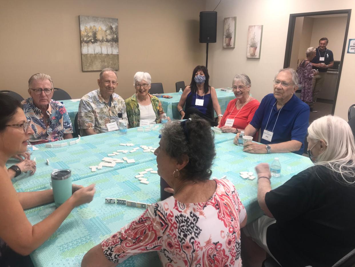 ACV clients and caregivers play a game at the ACV office in Palm Desert.