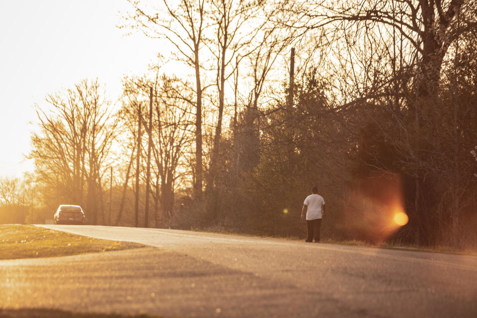 A man walks along Finde Naifeh Drive in Mason.  (Andrea Morales for NBC News)