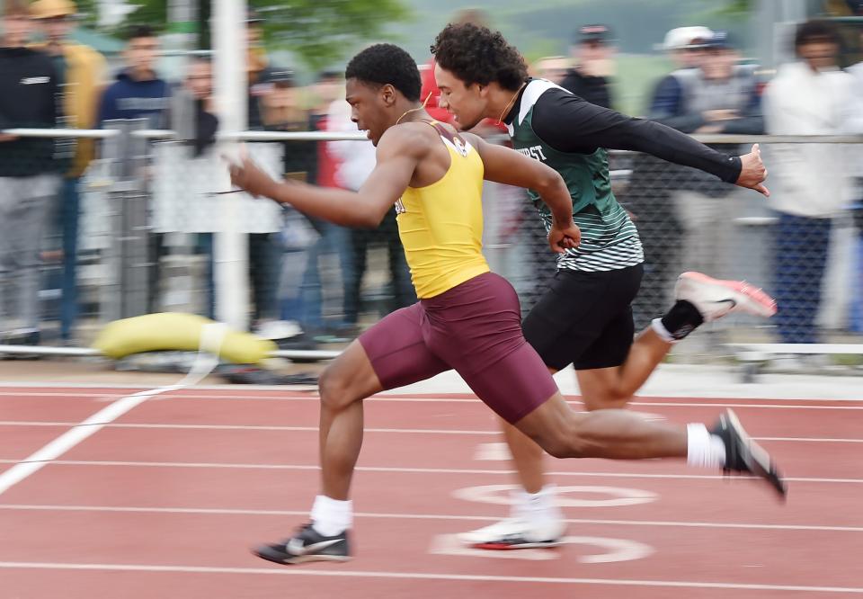 North East High School's Jamari Curlett, left, edges Mercyhurst Prep's Camden Bryant to win the Class 2A boys 100-meter dash during the District 10 track and field championships at Slippery Rock University in Slippery Rock on May 20, 2023. 