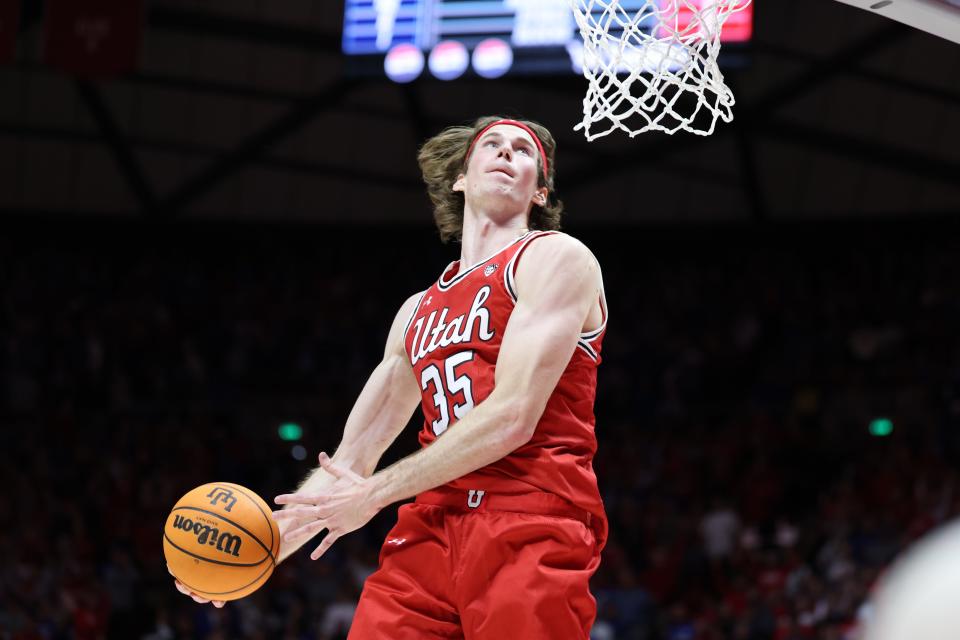 Utah Ues center Branden Carlson dunks the ball against Brigham Young during the second half at Jon M. Huntsman Center.