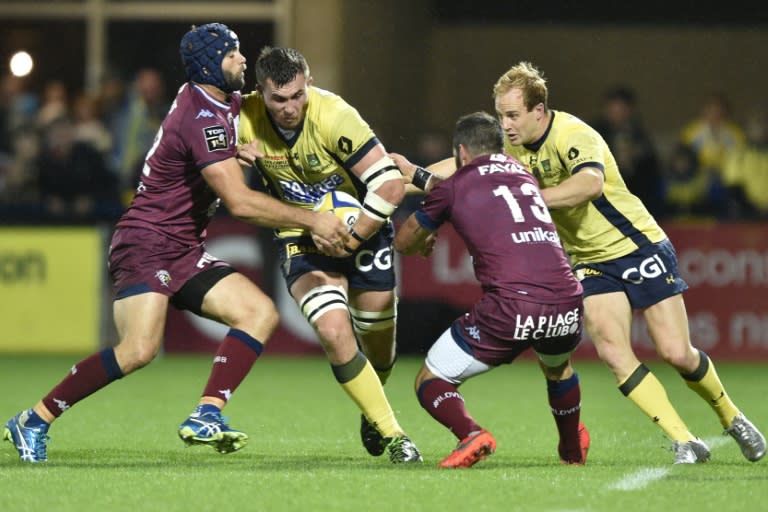 Clermont's French lock Paul Jedrasiak (2nd L) runs with the ball during the French Top 14 rugby union match between ASM Clermont and Union Bordeaux-Begles at Michelin Stadium in Clermont-Ferrand, central France, on September 17, 2016