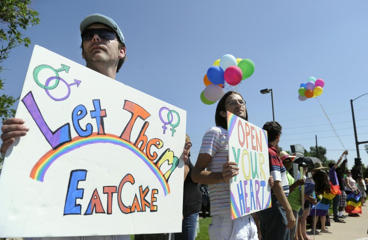 Engaged gay couple Charlie Craig and David Mullins were joined by supporters in Lakewood, Colo., in 2012 to protest Masterpiece Cakeshop. (Photo: Kathryn Scott Osler/The Denver Post via Getty Images)