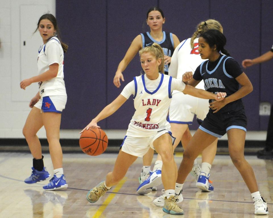 Zane Trace's Chloe Heshiser (#1) maintains possession of the ball during the Pioneers' scrimmage against the Adena Warriors on Nov. 17, 2023 at Unioto High School.