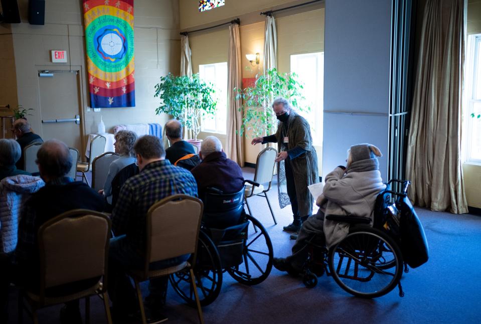 Greeter Mauni Mitchel creates a place for a member to roll into at Edgehill United Methodist Church in Nashville, Tenn., Sunday, Feb. 18, 2024.