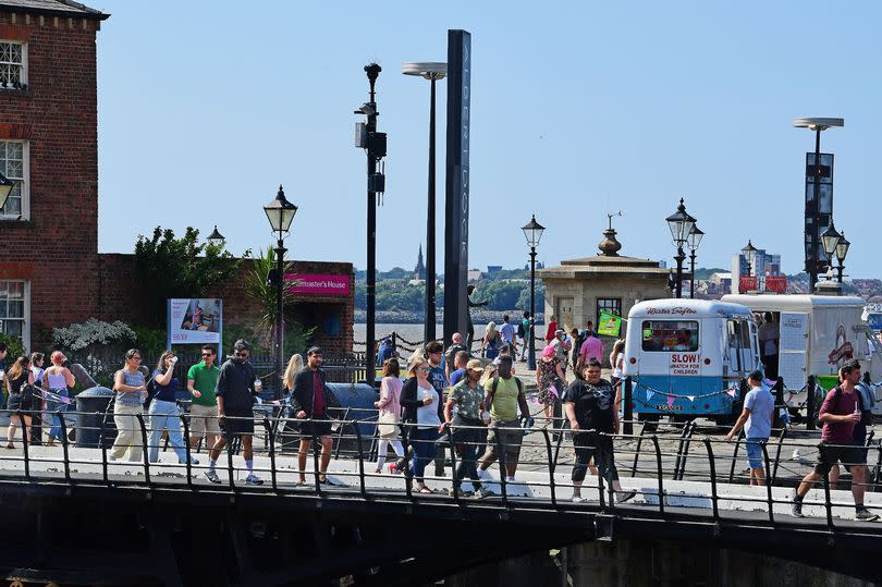 People enjoying some sunshine on the Liverpool waterfront