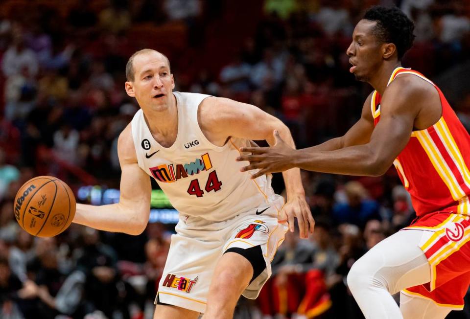 Miami Heat center Cody Zeller (44) looks to pass the ball as Atlanta Hawks forward Onyeka Okongwu (17) defends during the first quarter of an NBA game at the Miami-Dade Arena on Monday, March 6, 2023, in downtown Miami, Fla.