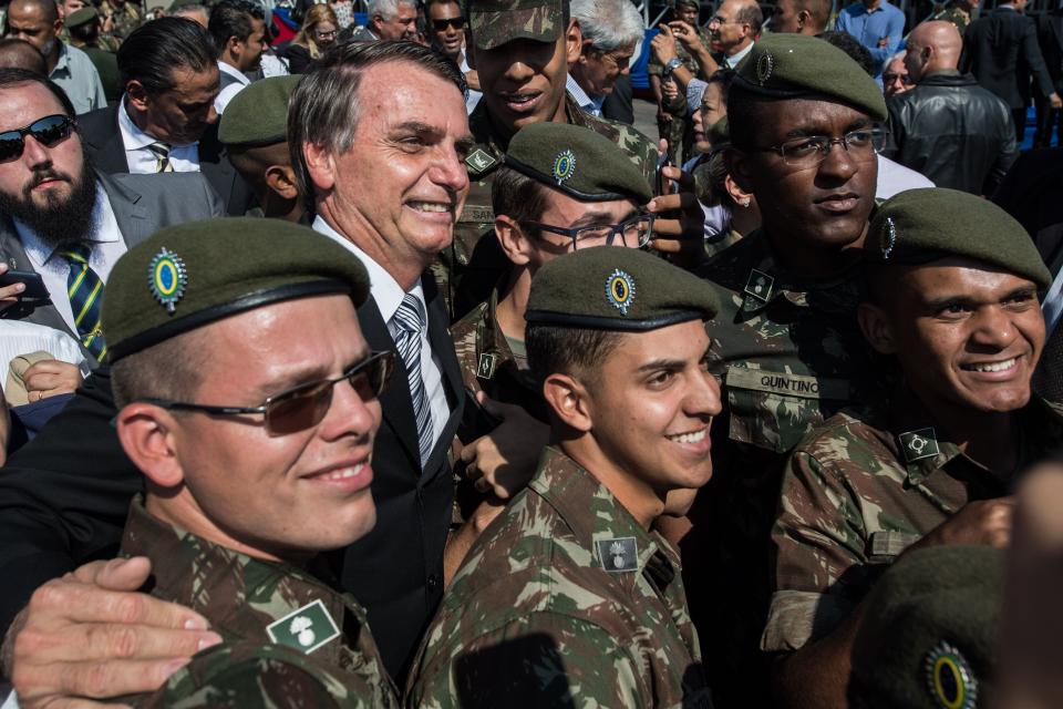 Bolsonaro is seen surrounded by troops at the Sao Paulo event. (Photo: NELSON ALMEIDA via Getty Images)