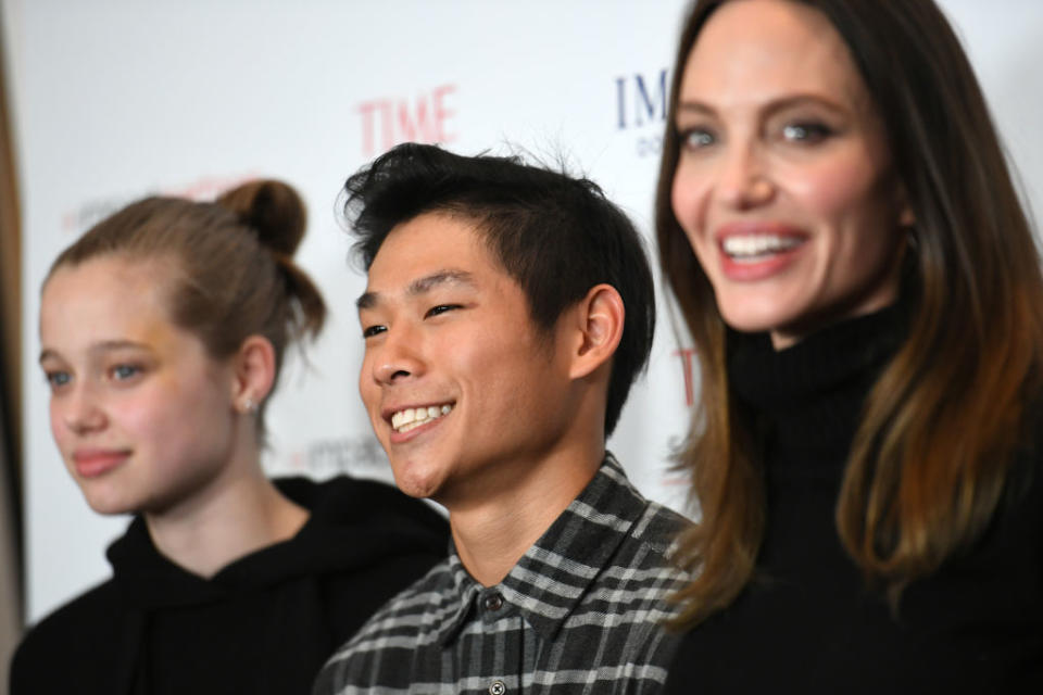 LOS ANGELES, CALIFORNIA - NOVEMBER 18: (L-R) Shiloh Jolie-Pitt, Pax Thien Jolie-Pitt and actress Angelina Jolie attend the Los Angeles premiere of MSNBC Films' "Paper &  Glue: A JR Project" at Museum Of Tolerance on November 18, 2021 in Los Angeles, California. (Photo by JC Olivera/Getty Images)
