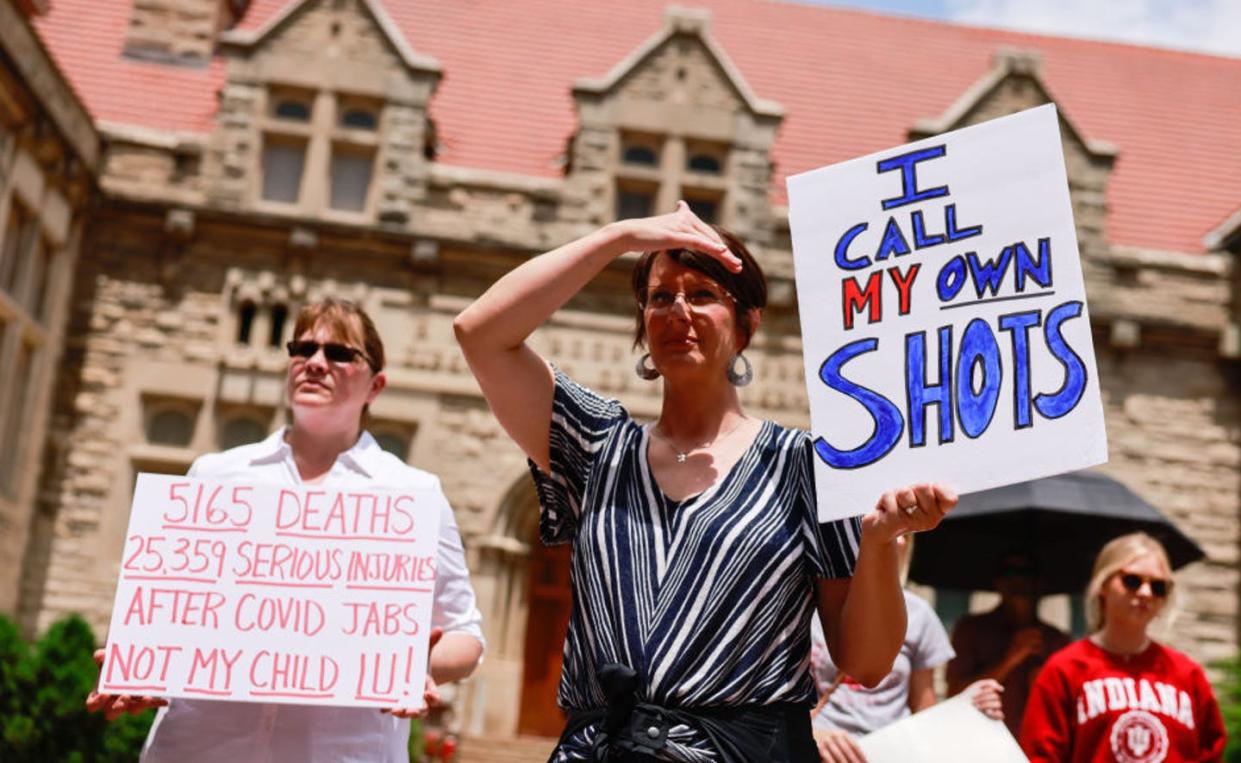 <span class="caption">Protesters gather at Indiana University in June 2021 to demonstrate against mandatory COVID-19 vaccinations for students, staff and faculty. </span> <span class="attribution"><a class="link " href="https://www.gettyimages.com/detail/news-photo/protesters-holding-placards-gather-at-indiana-universitys-news-photo/1233384399?adppopup=true" rel="nofollow noopener" target="_blank" data-ylk="slk:SOPA Images/LightRocket via Getty Images;elm:context_link;itc:0;sec:content-canvas">SOPA Images/LightRocket via Getty Images</a></span>