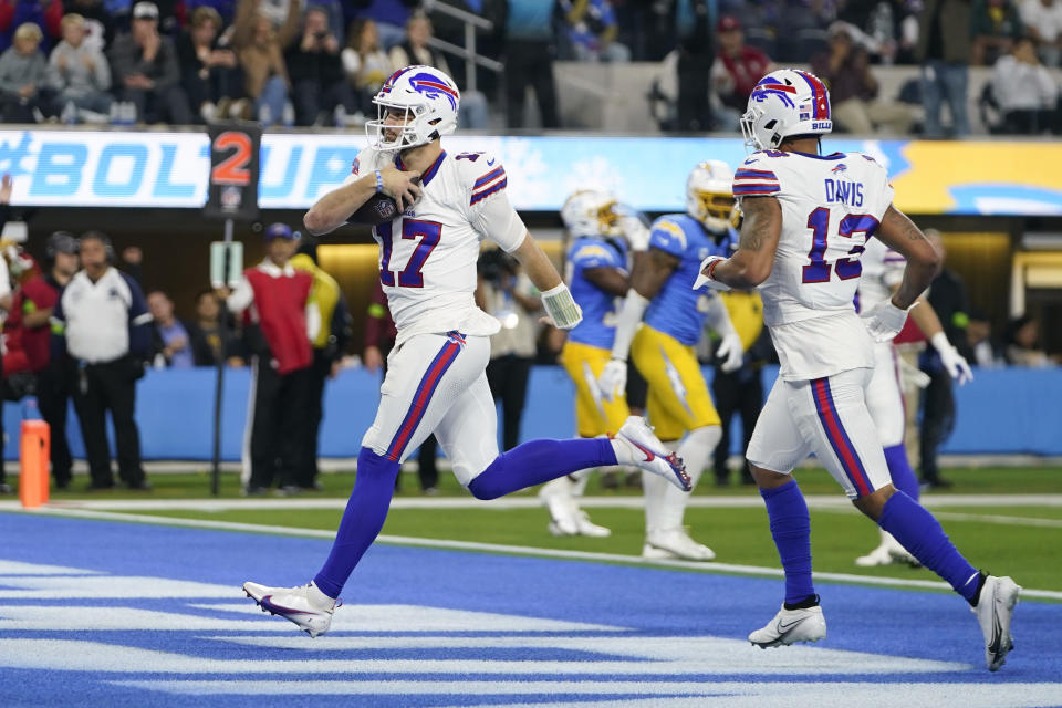 Buffalo Bills quarterback Josh Allen (17) scores a rushing touchdown during the first half of an NFL football game against the Los Angeles Chargers, Saturday, Dec. 23, 2023, in Inglewood, Calif. (AP Photo/Ryan Sun)