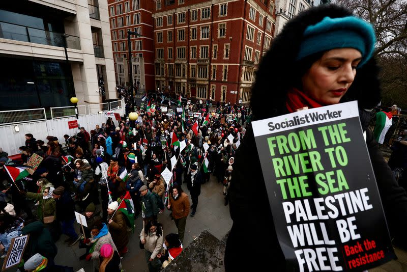 FILE PHOTO: People take part in a protest to mark 100 days since the start of the ongoing Israel-Hamas conflict, in London