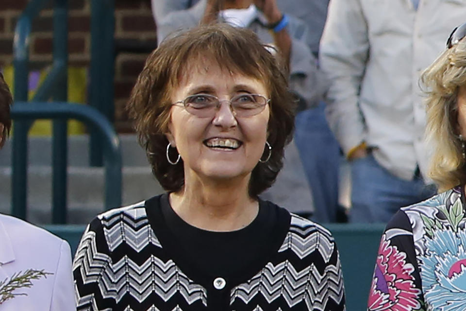 FILE - In this April 7, 2012, file photo, Jane "Peaches" Bartkowicz, one of the original nine women who helped start the women's professional tennis tour, is honored at the Family Circle Cup tennis tournament in Charleston, S.C. It’s the 50th anniversary of Billie Jean King and eight other women breaking away from the tennis establishment in 1970 and signing a $1 contract to form the Virginia Slims circuit. That led to the WTA Tour, which offers millions in prize money. (AP Photo/Mic Smith, File)