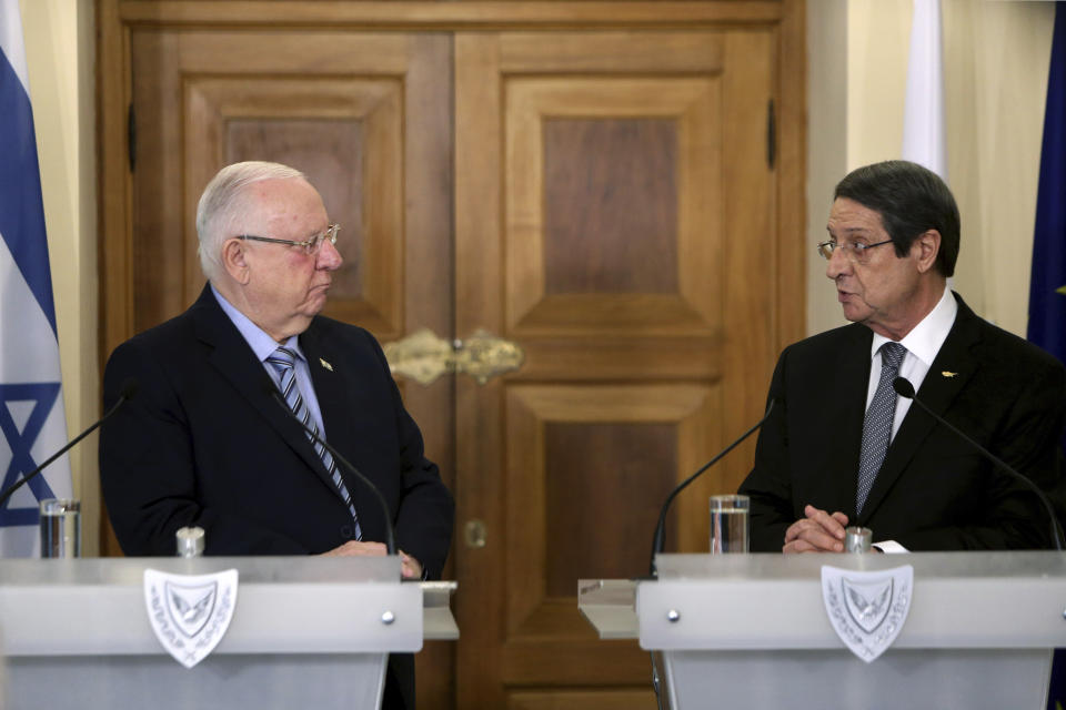 Cyprus' president Nicos Anastasiades, right, and Israel's President Reuven Rivlin talk, during a press conference after their meeting at the presidential palace in divided capital Nicosia, Cyprus, Tuesday, Feb. 12, 2019. Rivlin is in Cyprus for a one-day official visit for talks. (AP Photo/Petros Karadjias)