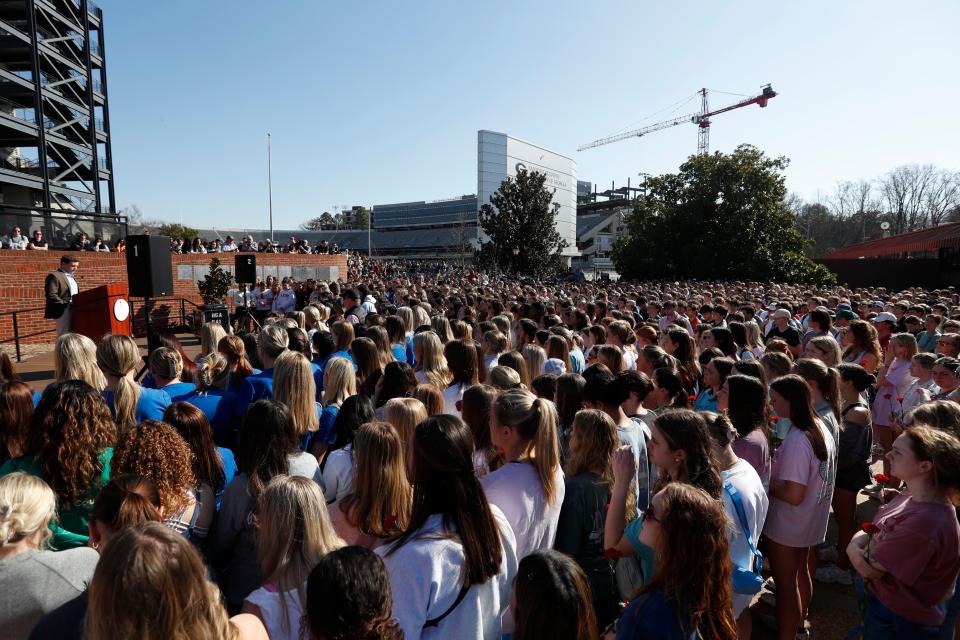 A crowd of people gather to mourn the loss of Laken Riley during a vigil for the Augusta University College of Nursing student at the Tate Plaza on the University of Georgia campus in Athens Feb. 26, 2024.