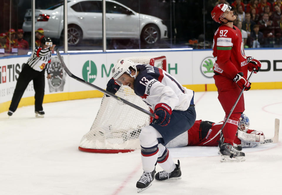 USA forward Colin McDonald celebrates his goal during the Group B preliminary round match between Belarus and USA at the Ice Hockey World Championship in Minsk, Belarus, Friday, May 9, 2014. (AP Photo/Darko Bandic)