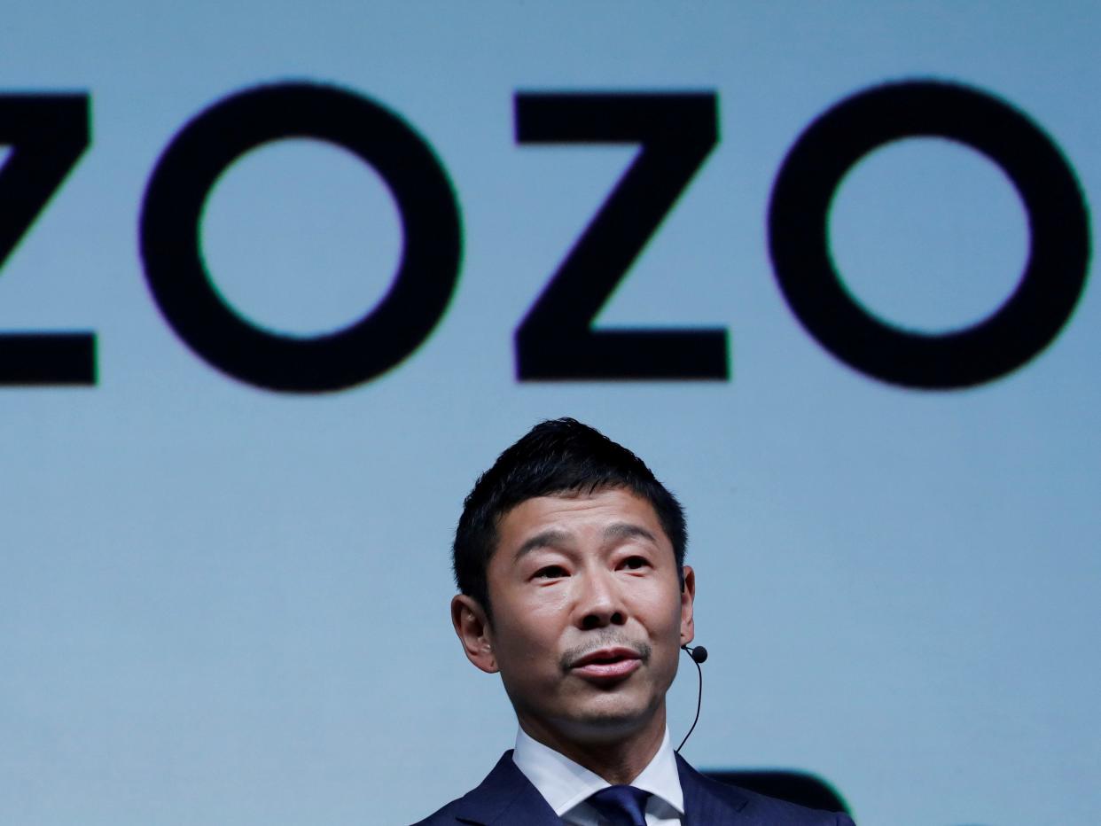 FILE PHOTO : Yusaku Maezawa, the chief executive of Zozo, which operates Japan's popular fashion shopping site Zozotown and is officially called Start Today Co, speaks at an event launching the debut of its formal apparel items, in Tokyo, Japan, July 3, 2018. REUTERS/Kim Kyung-Hoon/File Photo