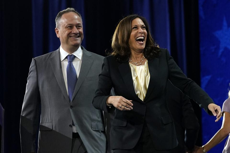 Democratic vice presidential candidate Sen. Kamala Harris, D-Calif., and her husband Doug Emhoff smile during the fourth day of the Democratic National Convention, Thursday, Aug. 20, 2020, at the Chase Center in Wilmington, Delaware.