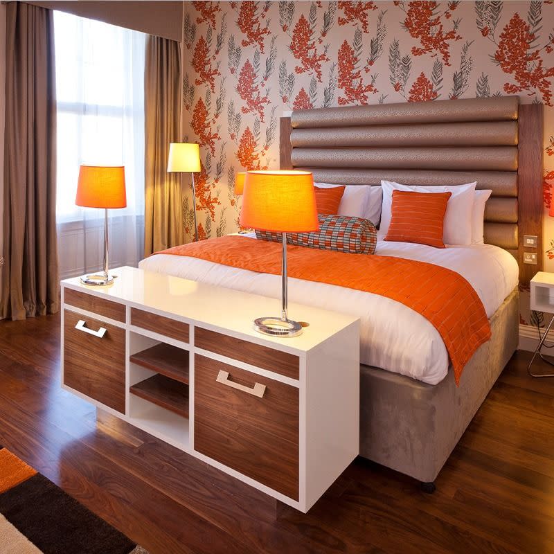 a double bed with lamps on either side at hotel indigo edinburgh