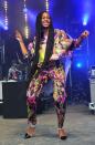 <p>Taking to the stage in 2014, Solange wore a colourful print outfit with killer heels and long flowing braids. </p>