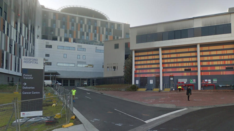 A 12-year-old-boy was taken to Gosford Hospital (pictured) with facial injuries after police said a 39-year-old man ran onto the footy field and threw him to the ground.