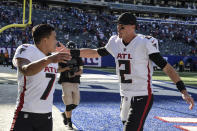 Atlanta Falcons kicker Younghoe Koo (7) and quarterback Matt Ryan (2) celebrate after their win over the New York Giants after an NFL football game, Sunday, Sept. 26, 2021, in East Rutherford, N.J. (AP Photo/Bill Kostroun)