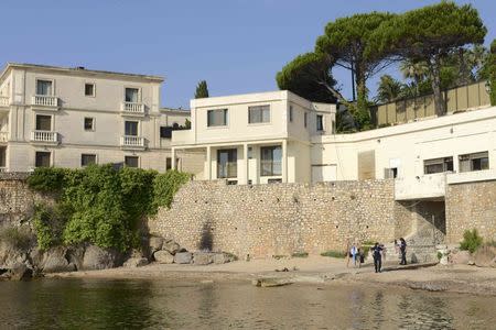 Municipal police partrol the public beach called "La Mirandole" which is seen below the villa owned by the king of Saudi Arabia in Vallauris - Golf Juan, France, July 18, 2015. Unauthorized work initiated at the request of the Saudi royal family to build an access from the villa to the public beach, which included laying a cement slab in the sand, has been interrupted, according to the French media. Access to the small beach is due to be closed to the public for security measures during the summer holiday stay of Saudi Arabia's King Salman and his entourage. REUTERS/Jean-Pierre Amet