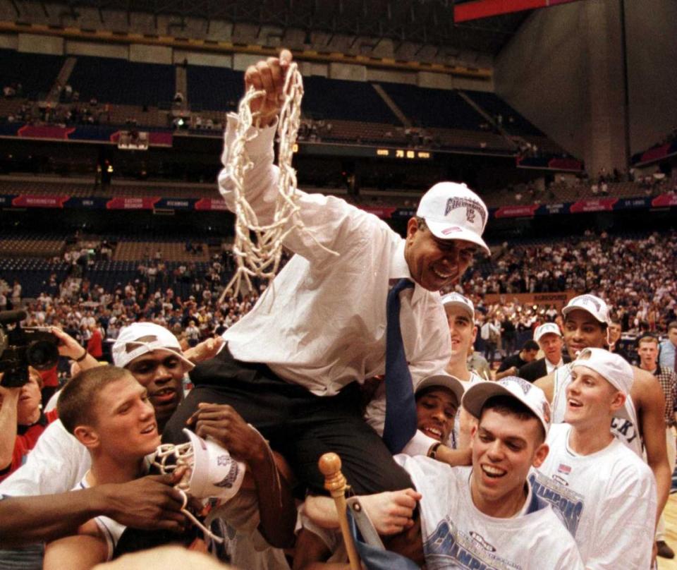 3/31/98 1A: FOR PUBLISHED CUTLINE / CAPTION, SEE VUTEXT SAVE. **UNPUBLISHED NOTES : ** (CR. 3/28/98 GREEN) Members of the Kentucky Wildcats basketball team lift coach Tubby Smith onto their shoulders Monday night following their victory in the NCAA Championship game vs Utah. Photo By: Christopher A. Record/Staff