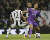 <p>Real Madrid’s Cristiano Ronaldo, right, challenges for the ball with Juventus’ Alex Sandro during the Champions League final soccer match between Juventus and Real Madrid at the Millennium Stadium in Cardiff, Wales, Saturday June 3, 2017. (AP Photo/Tim Ireland) </p>