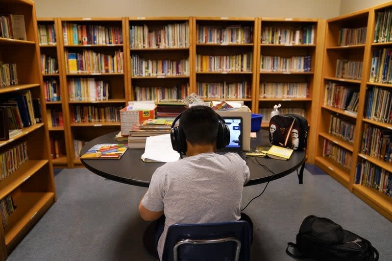 In this Aug. 26, 2020, file photo, a Los Angeles Unified School District student attends an online class at the Boys & Girls Club of Hollywood in Los Angeles. (AP Photo/Jae C. Hong, File)