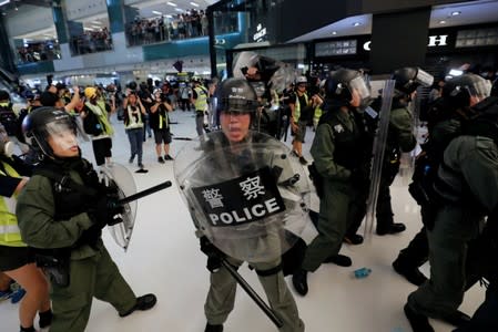 Riot police try to disperse pro-democracy protesters inside a mall after a march at Sha Tin District of East New Territories, Hong Kong