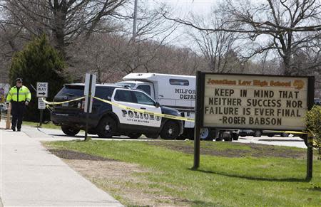 Police guard the front of Jonathan Law High School in Milford, Connecticut April 25, 2014. REUTERS/Michelle McLoughlin