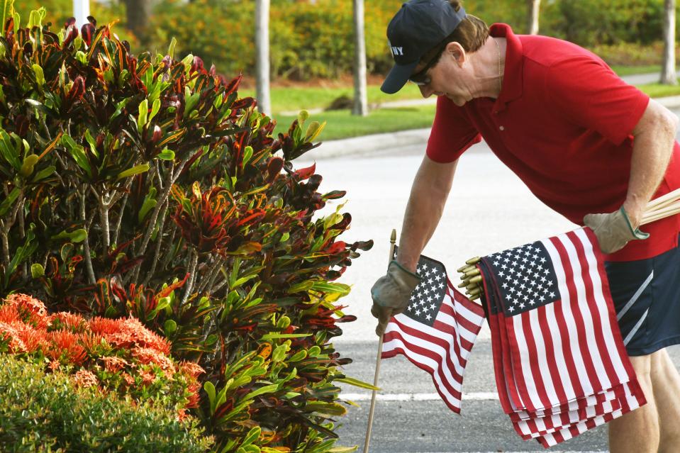 Yuri Linna has been placing flags in front of homes throughout his Palm Bay neighborhood since 2007 in advance of Memorial Day, Independence Day and Veterans Day.