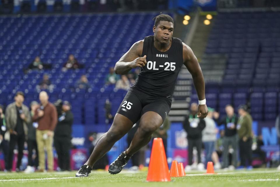 Georgia offensive lineman Broderick Jones runs a drill at the NFL scouting combine in March.