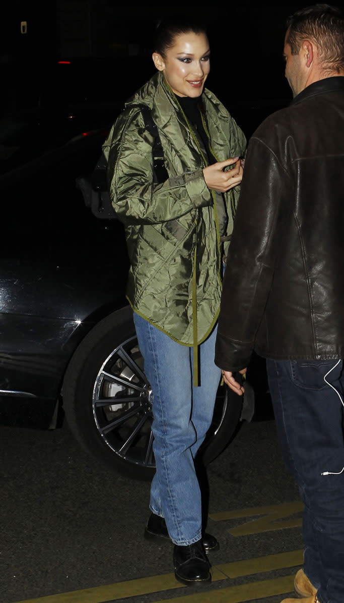 bella hadid, celebrity style, blue jeans, green coat, paris