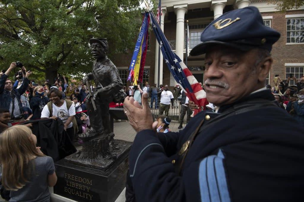 The statue honouring Black enslaved men who enlisted and served in the Civil war was unveiled on Saturday  (AP)