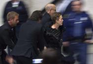 A protester is escorted out of the arena as President-elect Donald J. Trump speaks as part of his "USA Thank You Tour" at the DeltaPlex in Walker, Mich., Friday, Dec. 9, 2016. Trump is thanking supporters in Grand Rapids, noting that the state helped power him to the White House. (Cory Morse/The Grand Rapids Press-MLive.com via AP)