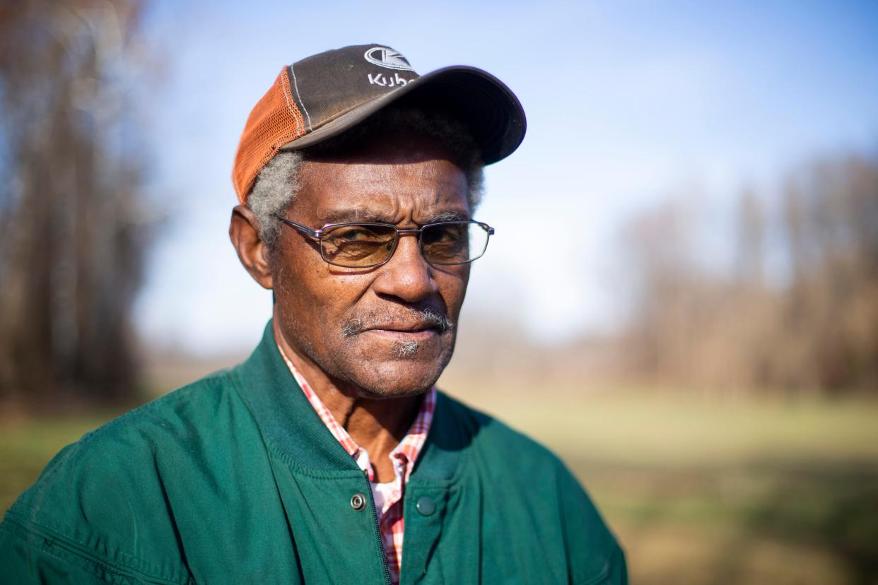 James Melvin Johnson Sr. poses for a portrait on part of his 40 acres of farmland in Jackson, Tenn., on Wednesday, Dec. 5, 2023. The land is currently empty but in season Johnson will grow soybeans. Johnson and his brother-in-law L.V. Jackson are applying for a piece of a $2.2 billion USDA Discrimination Financial Assistance Program, which aims to provide financial assistance to farmers, ranchers and forest landowners who experienced discrimination in USDA farm lending programs prior to 2021.