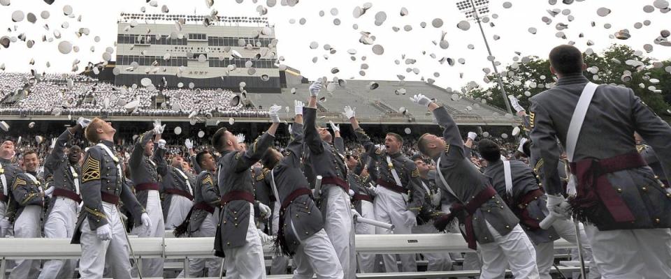 U.S. Military Academy graduates toss their hats during commencement ceremonies at West Point, N.Y., May 23, 2009.