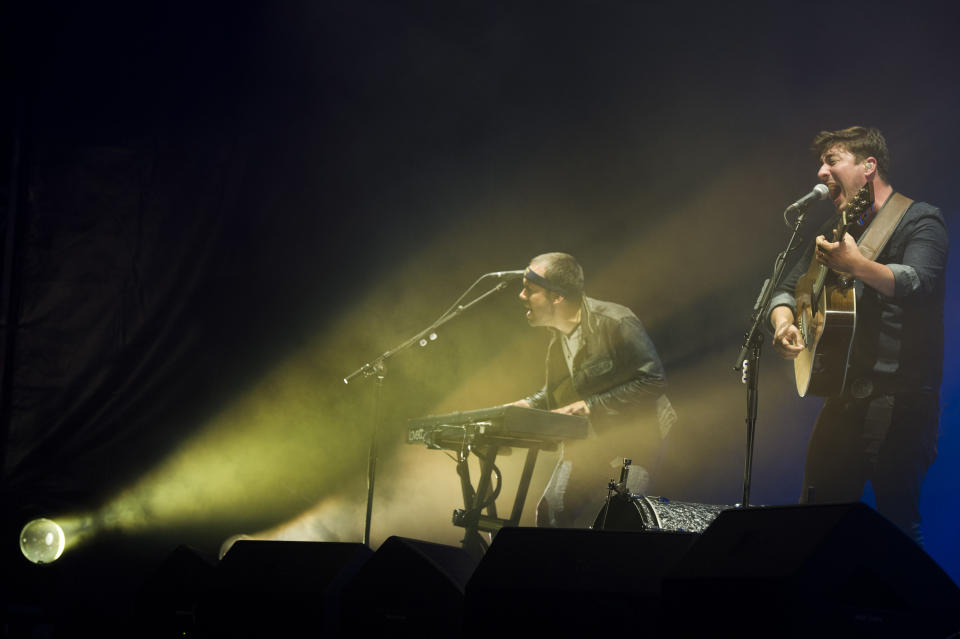 Mumford & Sons band members, from left, Ben Lovett and Marcus Mumford perform on Wednesday, Aug. 28, 2013 at the West Side Tennis Club in the Forest Hills neighborhood of the Queens borough of New York. (Photo by Charles Sykes/Invision/AP)