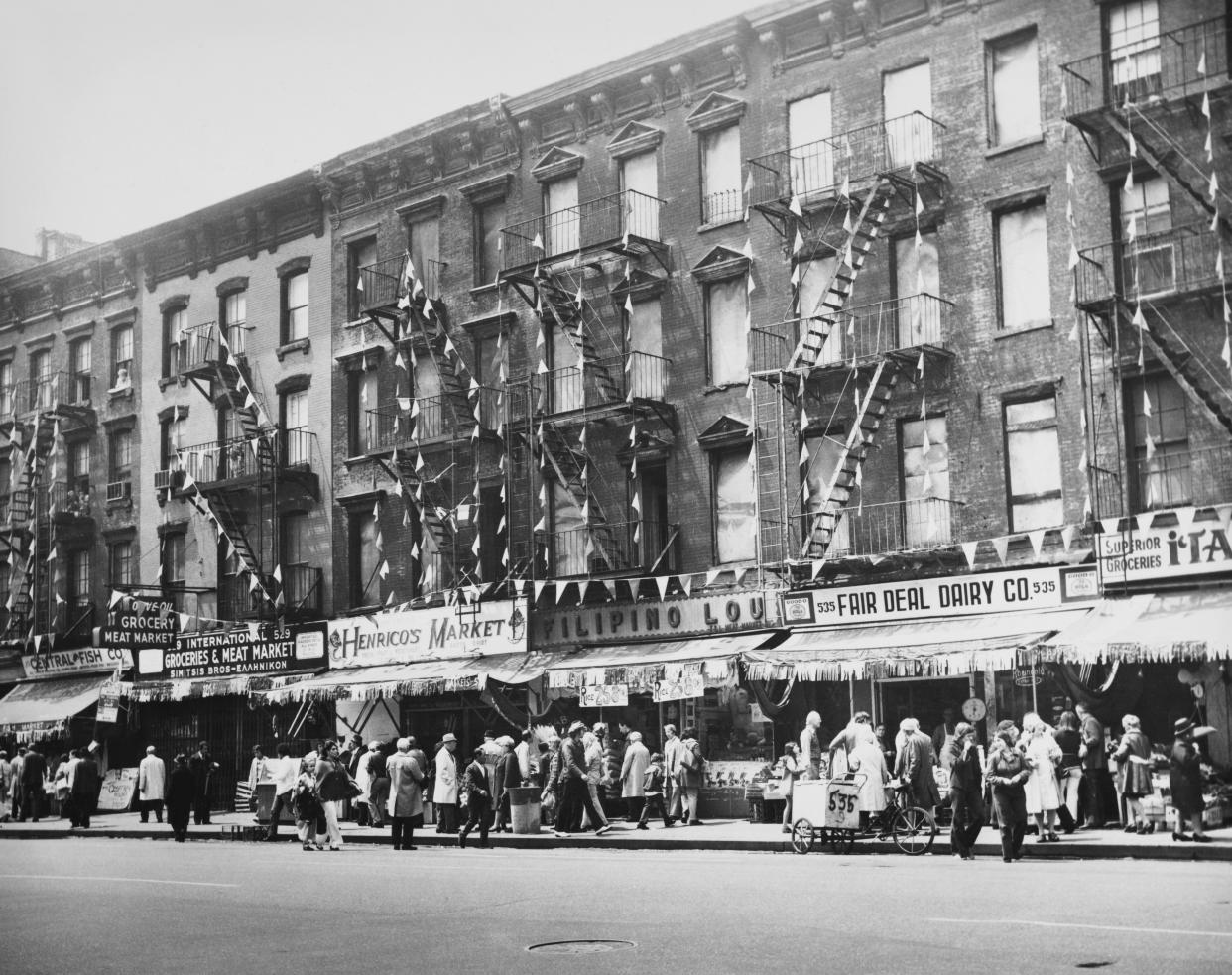 Pedestrians pass storefronts on Ninth Avenue at 40th Street in the Hell's Kitchen neighborhood in Midtown Manhattan, New York City, New York, 1974. Police in 2024 identified a teenage murder victim who was killed in the neighborhood in 1969.