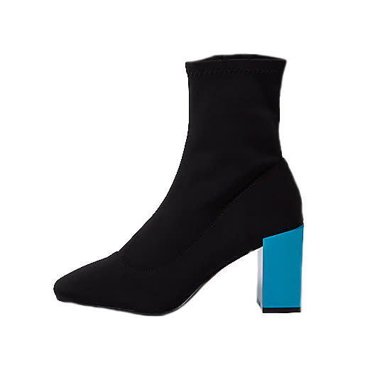 <p><a rel="nofollow noopener" href="https://www.riverisland.com/p/black-contrast-blue-block-heel-sock-boots-706424" target="_blank" data-ylk="slk:River island;elm:context_link;itc:0;sec:content-canvas" class="link ">River island</a> – £55 </p>