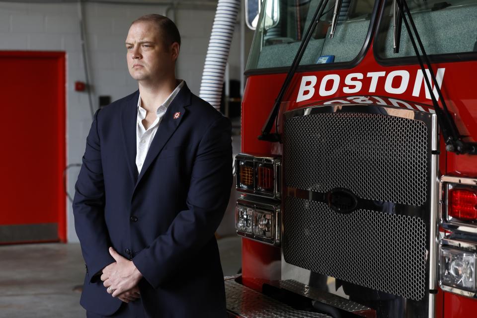 Firefighter Daniel Ranahan poses inside the Engine 28 fire station, Friday, July 14, 2023, in the Jamaica Plain neighborhood of Boston. (AP Photo/Michael Dwyer)