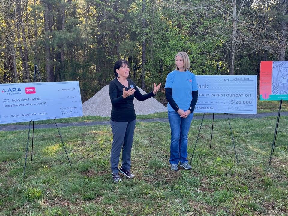 Carol Evans (left), executive director of Legacy Parks Foundation, talks with Marcy Wright, executive director of the American Rental Association, about the partnership that will benefit the park.