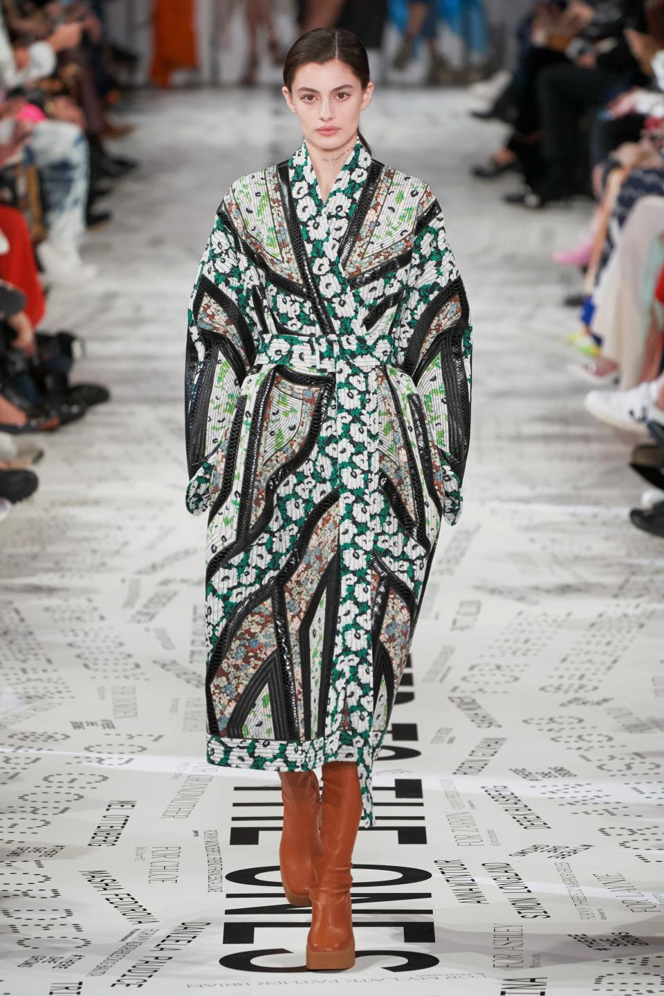 Stella McCartney continues to push the boundaries of sustainable design. For Fall 2019, she repurposed old fabric into quilted details on dresses or, in the case of this final look, an entire quilted coat.