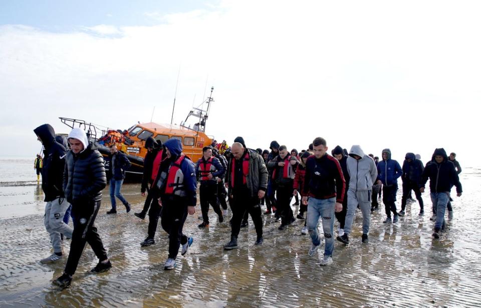 A group of people thought to be migrants are brought in to Dungeness, Kent, onboard the RNLI Dungeness Lifeboat, following a small boat incident in the Channel (Gareth Fuller/PA) (PA Wire)