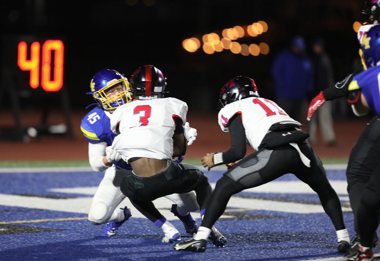 Maine-Endwell's T.J. Serkiz breaks through the offensive line and tackles Monroe's Tahjmir Mullins for a safety. Mullins had just got the hand off from Khaya Moses in the end zone when he got tackled.