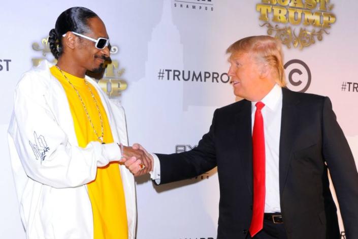 Snoop and Trump shake hands before the Comedy Central Roast of Donald Trump in New York City, March 9, 2011. (Photo by Andrew H. Walker/Getty Images)