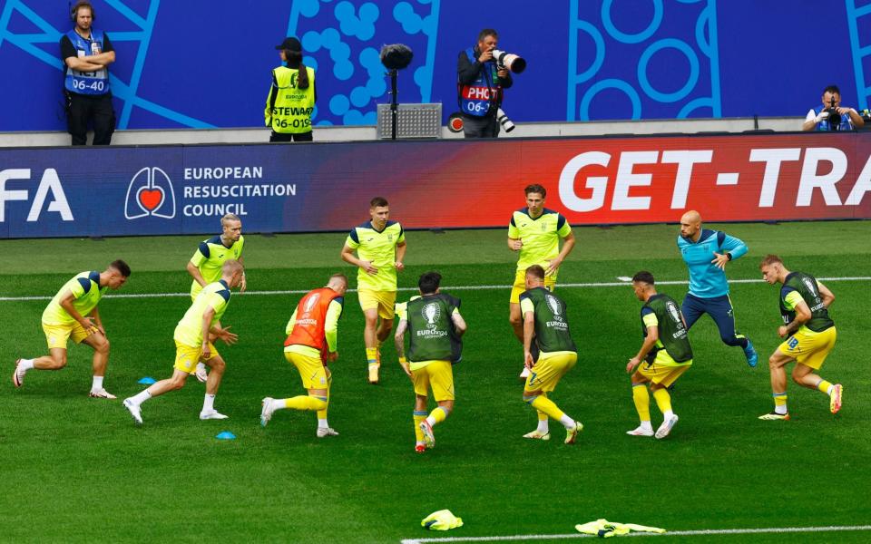 Ukraine warm up ahead of their vital game.