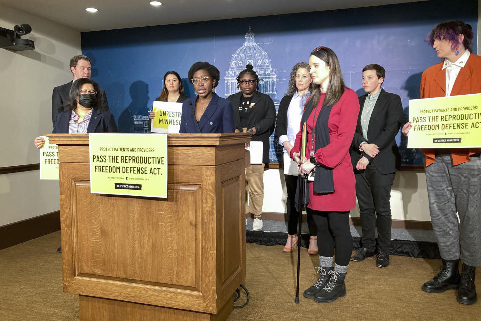 Democratic Minnesota state Rep. Esther Agbaje speaks at a news conference ahead of a vote on her bill in the Minnesota State Capitol on Monday, March 20, 2023, in St. Paul, Minn. The state House passed the bill by a 68-62 vote to prohibit enforcement in Minnesota of laws, subpoenas, judgements or extradition requests from other states against people who get, perform or assist with abortions in Minnesota. (AP Photo/Steve Karnowski)