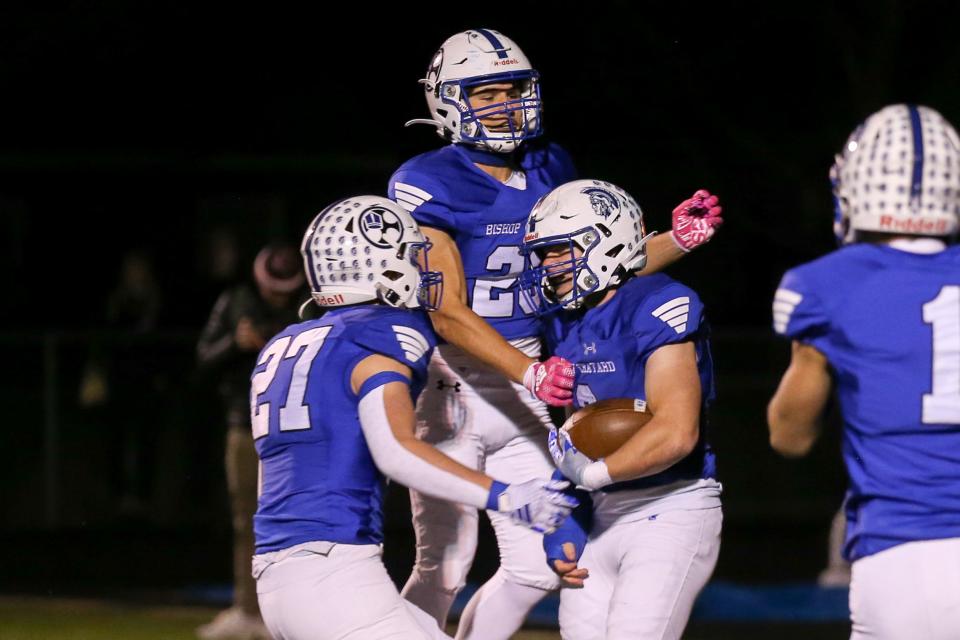 Players celebrate following a score by Bishop Chatard's Riley Kinnett (2) as Indianapolis Bishop Chatard takes on Knox High School in the IHSAA Football Class 3A Semi-State Championship, Nov 17, 2023; Indianapolis, IN, USA; at Bishop Chatard High School.
